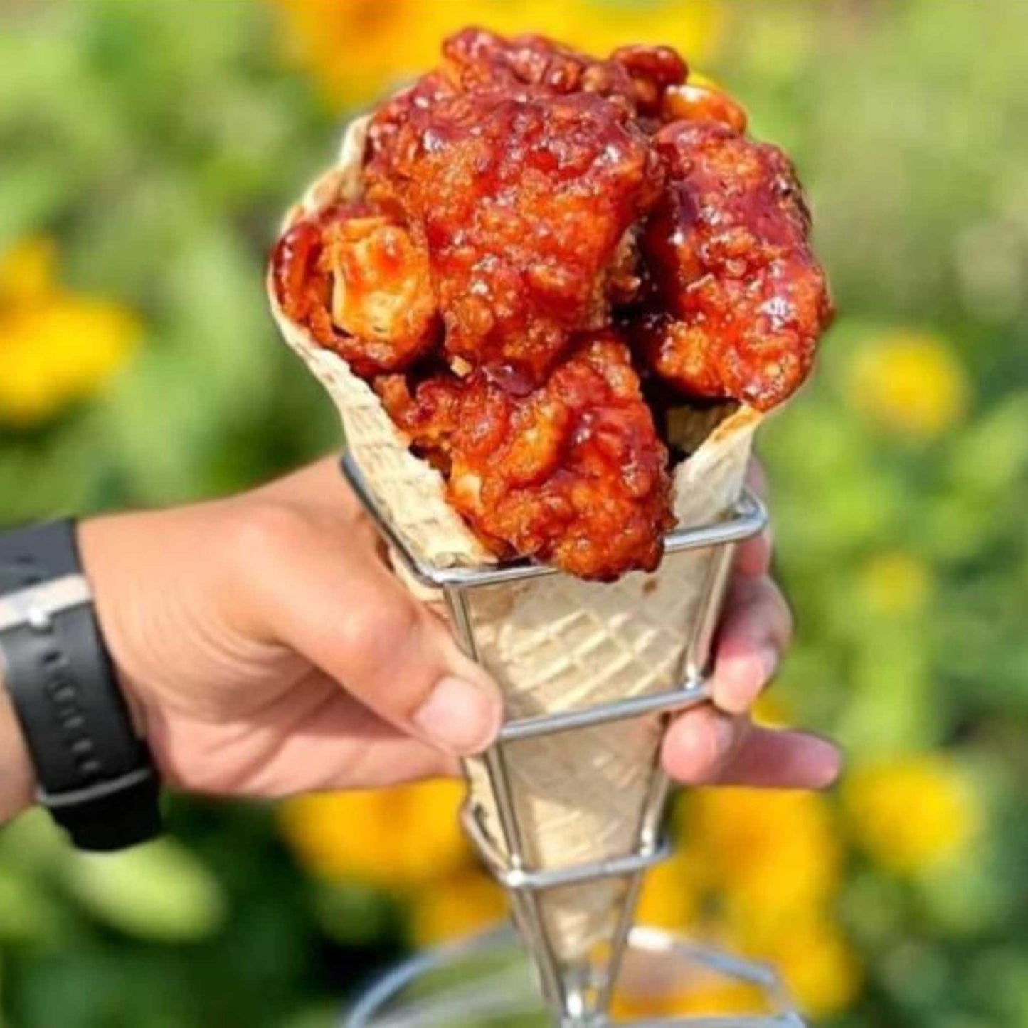 Hot Peri Peri Chicken Fingers in a waffle cone